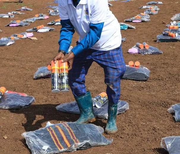 A HARO worker lays out relief kits for flood-displaced families in Afgooye, 2020