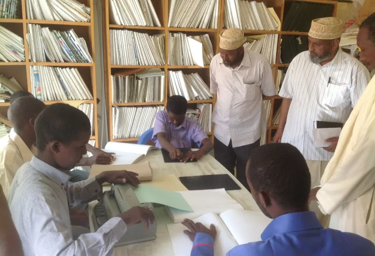Blind students read Braille books at the School of the Blind in Puntland during a HARO visit, 2014
