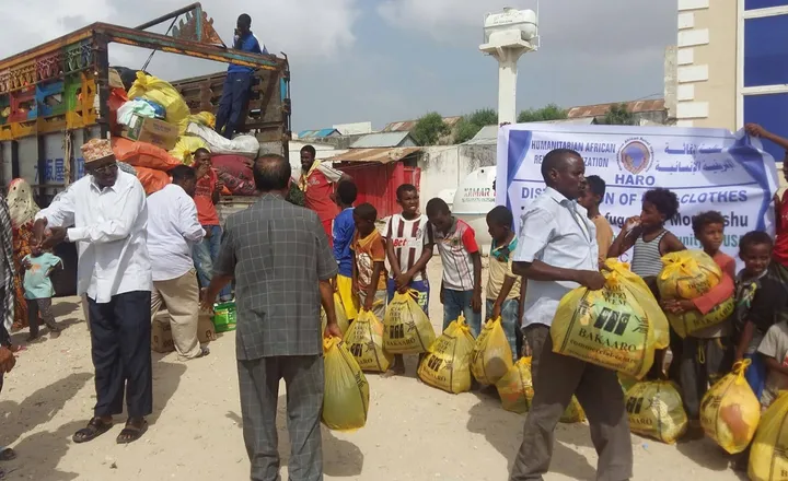 HARO staff hand relief packages to families at a rapid-response distribution in Mogadishu
