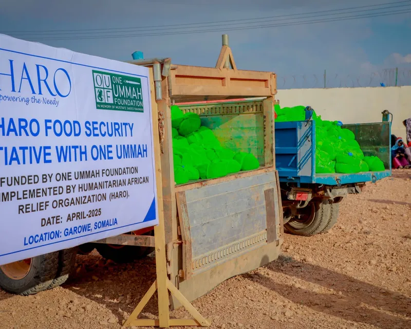 HARO Food Security Initiative with One Ummah: a truck loaded with food packages beside the distribution banner in Garowe, April 2025