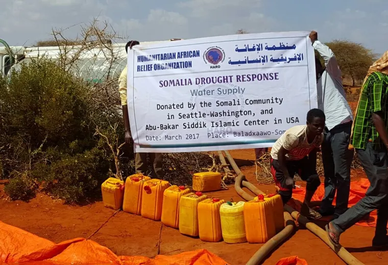 A HARO team fills tarpaulin water ponds from a tanker truck outside Balad Hawo, Gedo, 2017