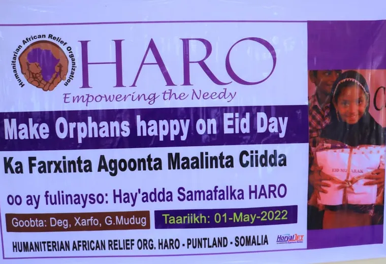 Children gathered under the Make Orphans Happy on Eid Day banner in Xarfo, Galmudug, 2022